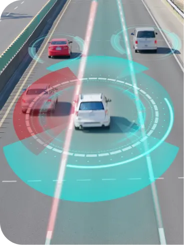 A car driving on a multi-lane road is shown with digital overlays representing autonomous driving technology, including sensor detection and lane monitoring, with two other cars visible ahead.