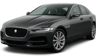 A sleek, dark gray Jaguar sedan is shown from a front-side angle, highlighting its modern design, distinctive headlights, chrome accents, and alloy wheels on a plain background.